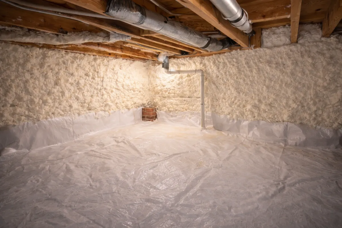 Closed cell spray foam on crawl space walls by Level Up Insulation Co. in a Denver home providing R-15 to R-19 thermal insulation with integrated moisture barrier