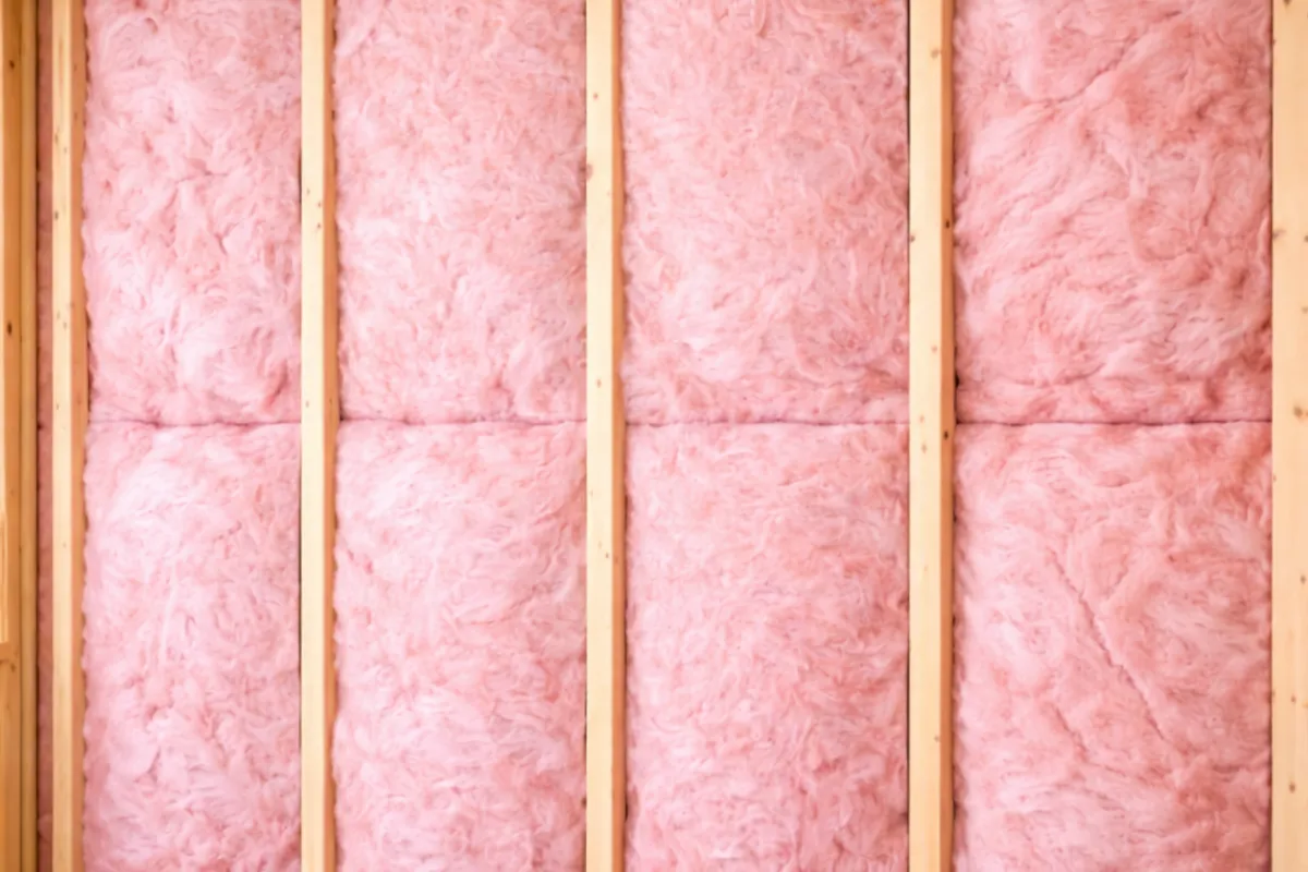 Properly installed R-21 fiberglass batts by Level Up Insulation Co. in a Denver home wall cavity with full contact fit and zero gaps for rated thermal performance